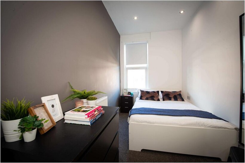 Bright and neatly maintained master bedroom fea...