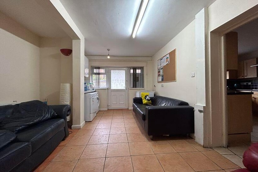 A bright and inviting living room with comforta...