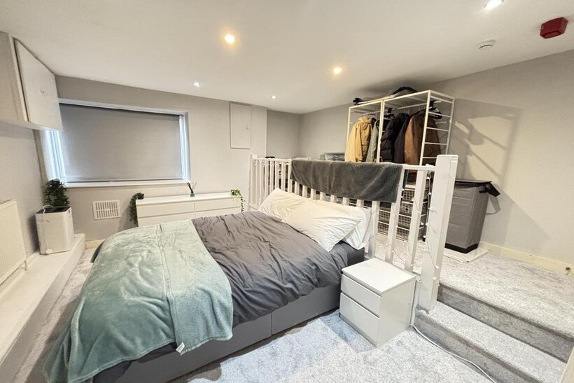 A spacious and well-maintained master bedroom f...