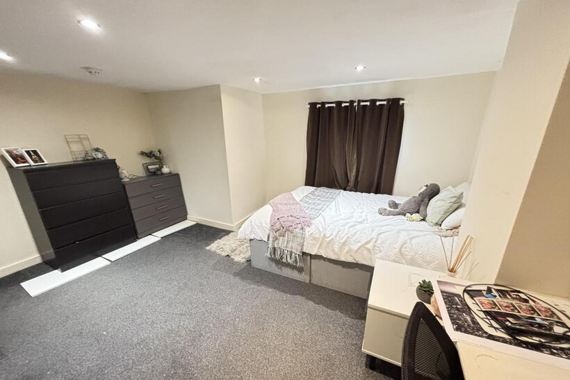 A spacious and well-maintained master bedroom f...