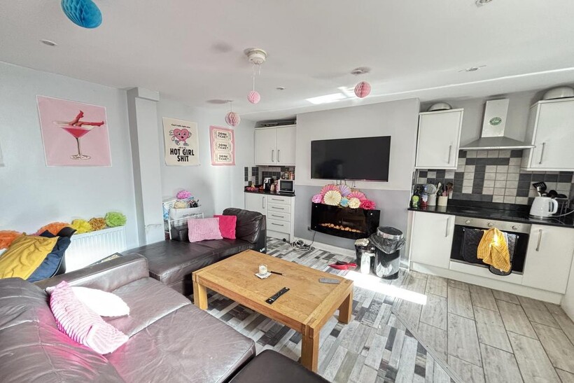 A bright and spacious living room with contempo...