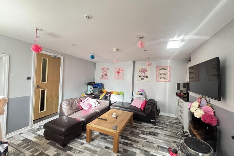 A bright and modern living room featuring a lar...