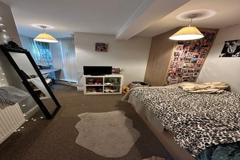 A cozy, well-lit living room with a comfortable...