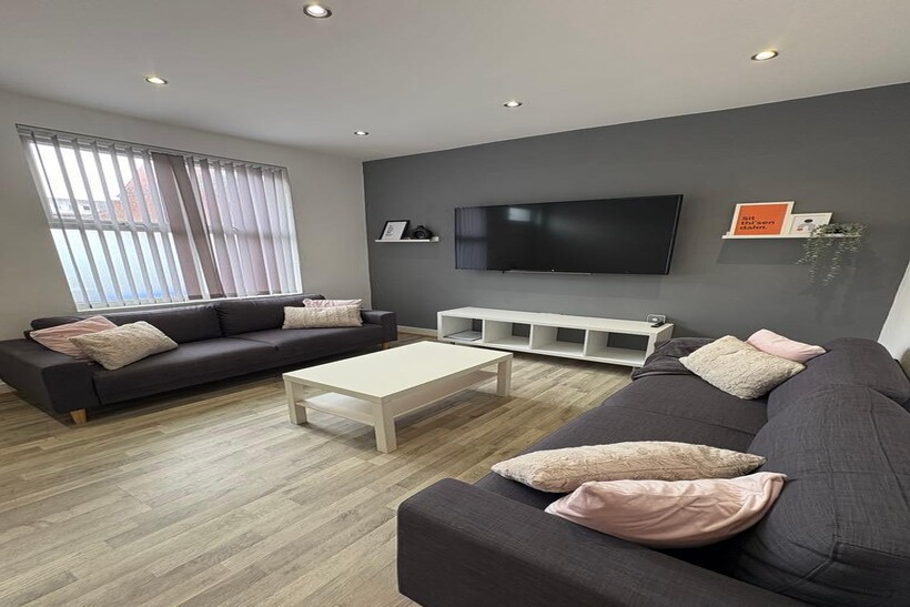 Bright, modern living room with two comfortable...