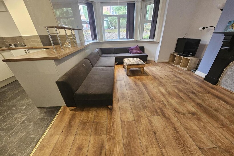 Bright, modern open-plan living area with a lar...