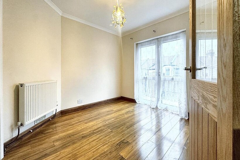 Bright, well-presented bedroom with polished wo...