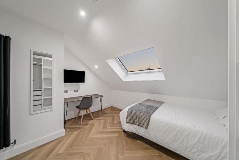 A clean and bright small bathroom featuring a w...