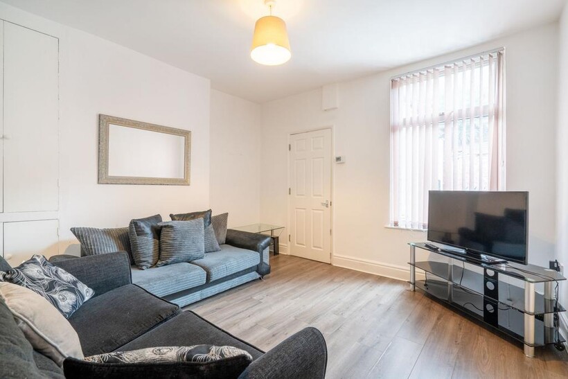 Bright and welcoming living room featuring two ...