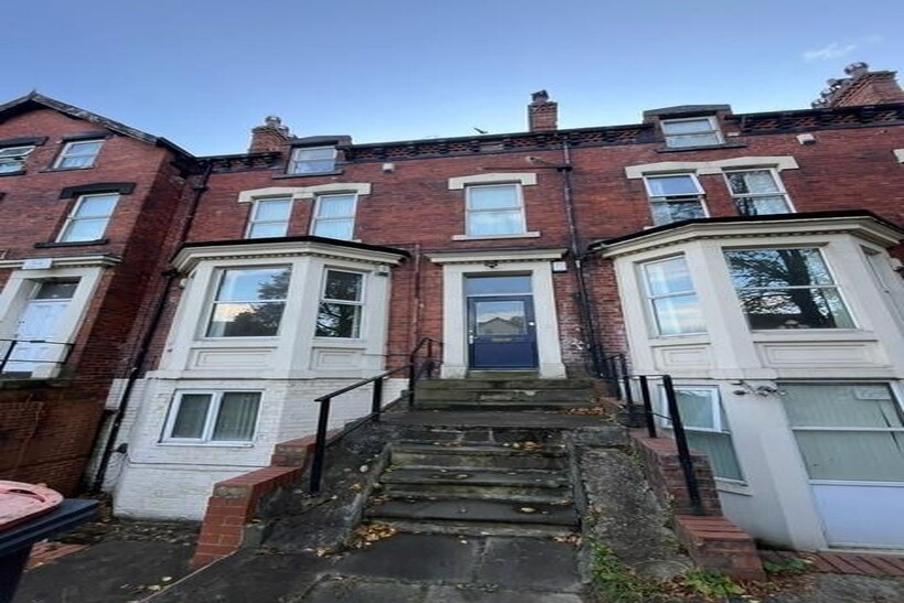 Attractive red-brick terraced property with rai...