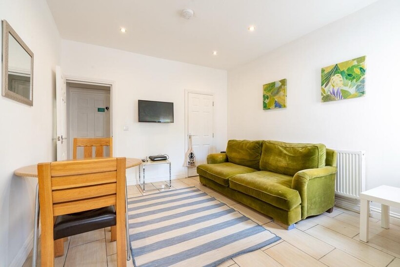 Bright and spacious living room featuring a com...