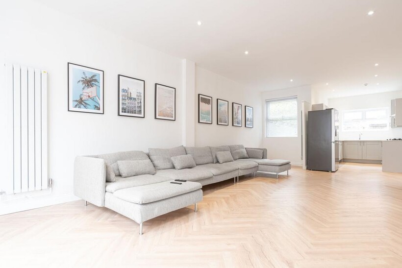 Bright, modern open-plan living room with a lon...