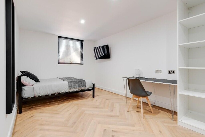 A bright and modern living room with ample natu...