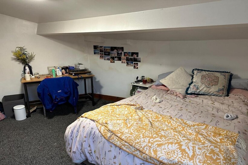 A cozy bedroom with a double bed, decorated wit...