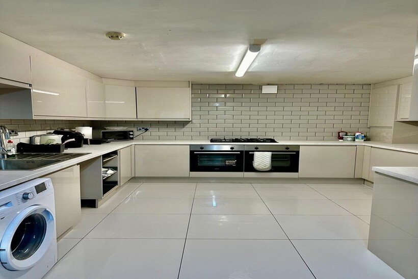 A clean and modern kitchen with bright lighting...