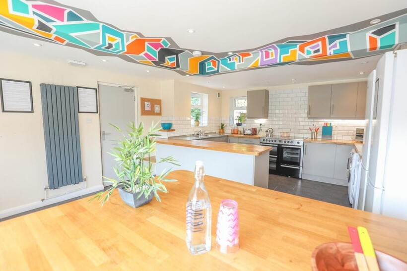 Bright and modern kitchen featuring ample count...