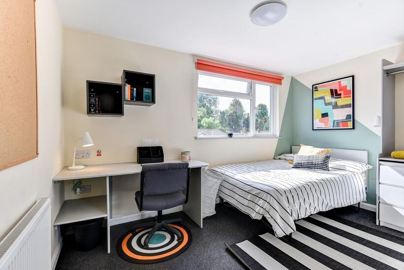 Bright and modern double bedroom featuring a co...