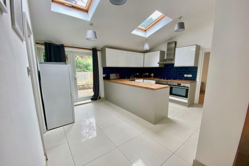 Bright, contemporary kitchen with skylights and...