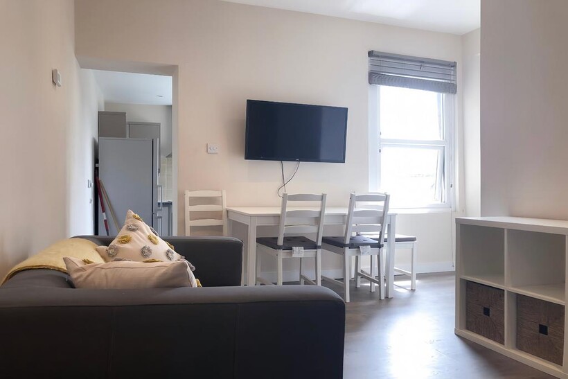 A modern and inviting living room featuring com...