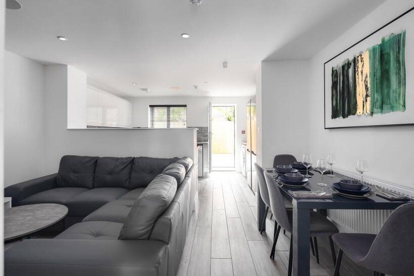 A spacious and modern living room with ample na...