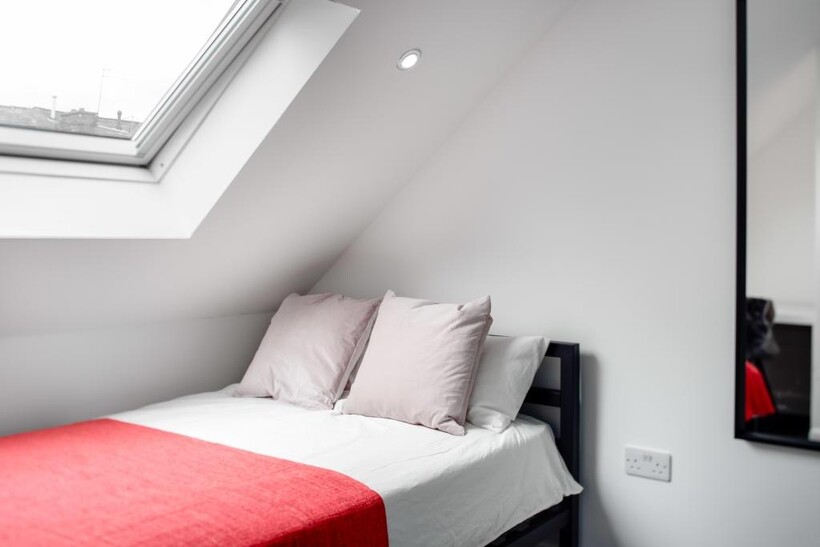 A bright and well-maintained master bedroom fea...