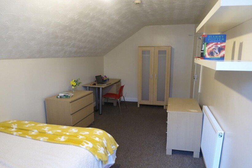 Bright, neatly presented attic bedroom with slo...