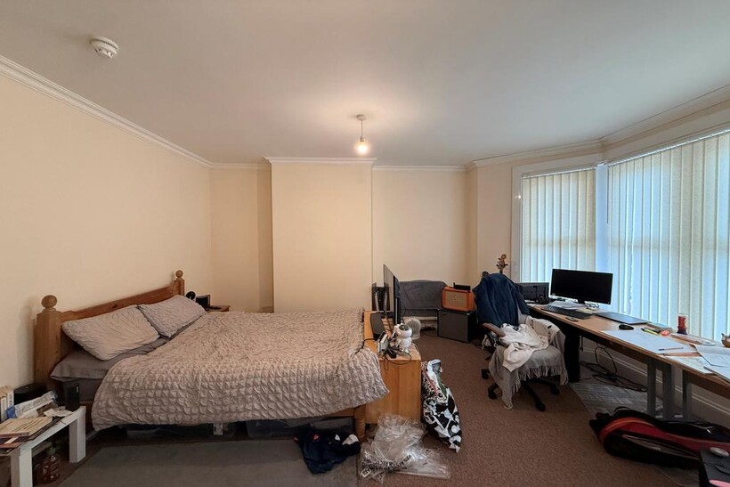 Spacious, airy bedroom with a large double bed,...
