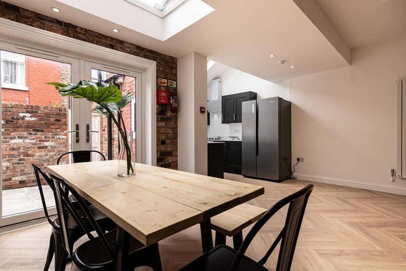 Bright, modern open-plan kitchen and dining are...