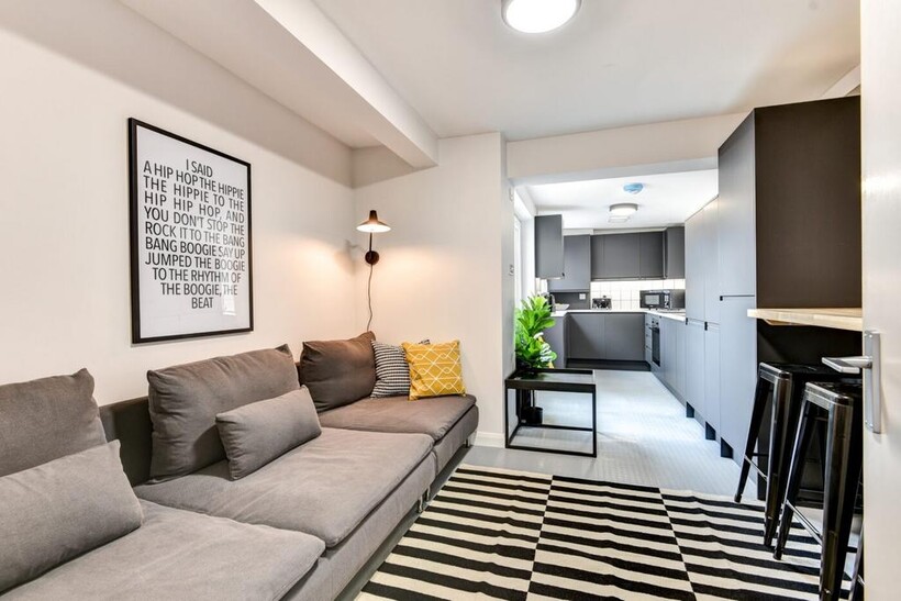 Bright, modern open-plan living area with a com...