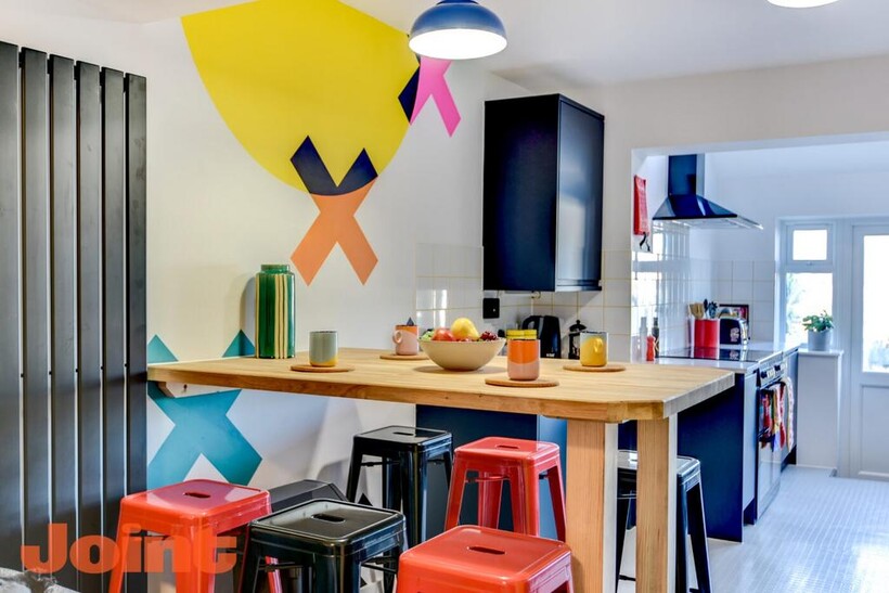 Bright, contemporary kitchen with a large woode...