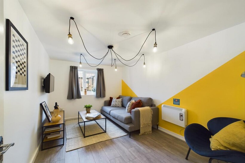 Bright and welcoming modern living room featuri...