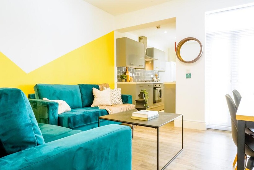 A stylish and spacious modern living room featu...