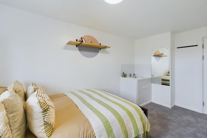 A stylish and inviting double bedroom featuring...