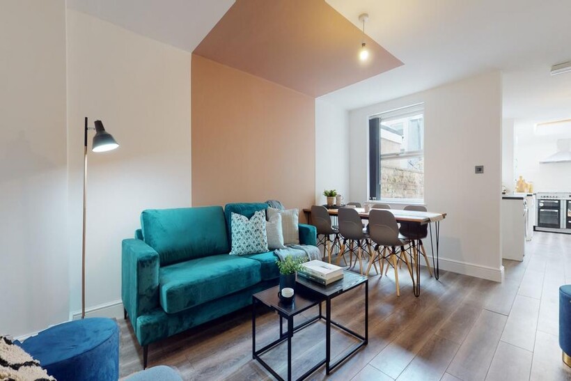 A stylish and spacious modern living room, perf...