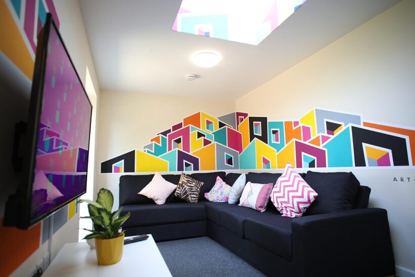 Contemporary lounge with a large black L-shaped...