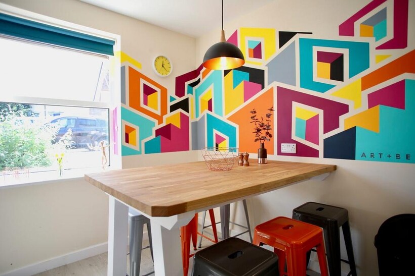 Bright, modern breakfast bar with a solid wood ...