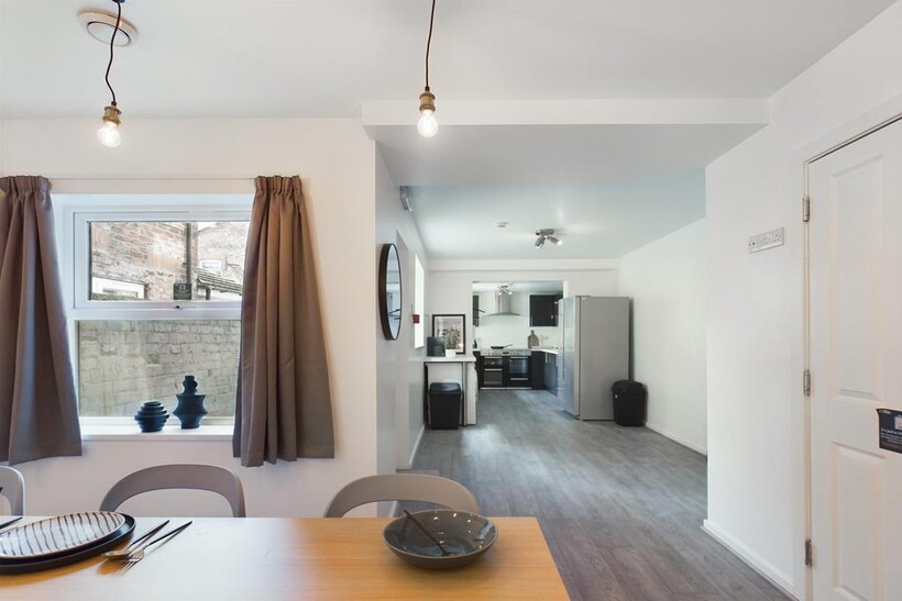 Bright and inviting living room with ample natu...