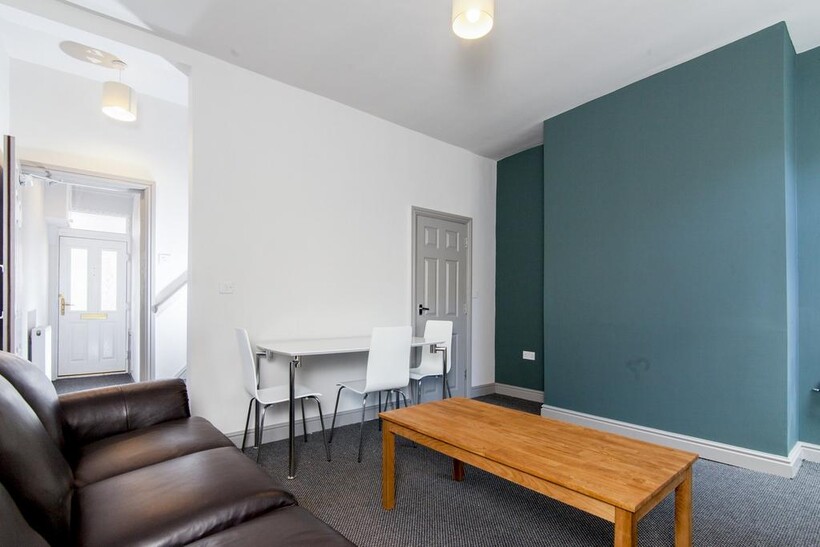 Spacious and inviting living room featuring com...