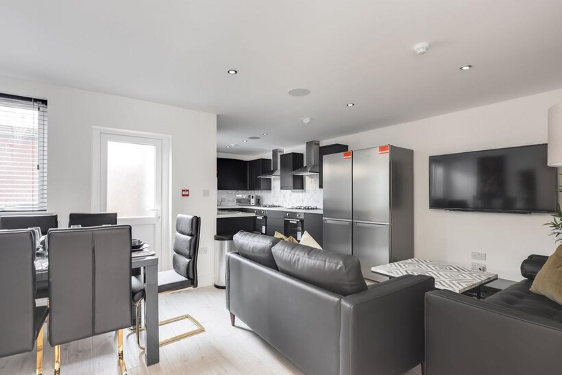 Modern, spacious living area featuring contempo...