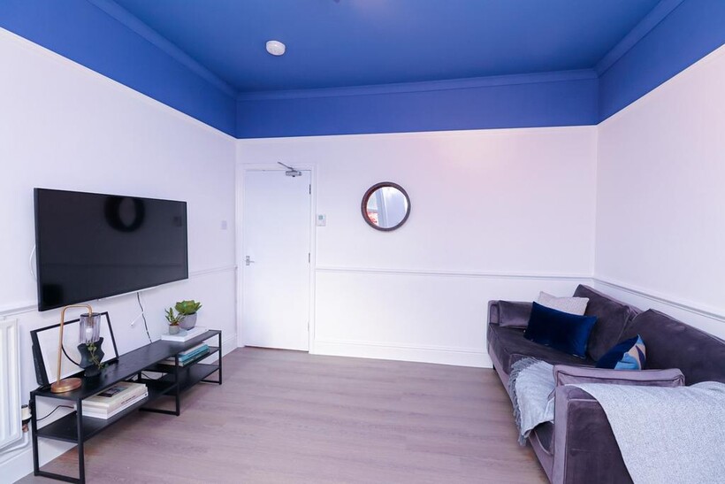 A stylish and spacious modern living room, perf...