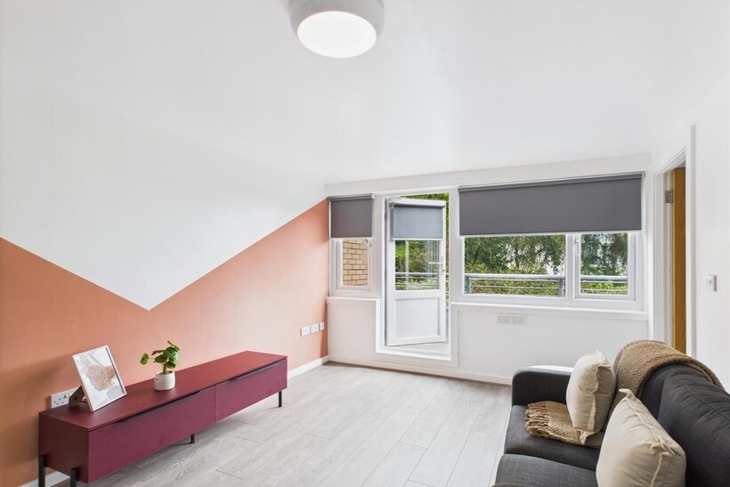 Bright, modern living room with a feature accen...