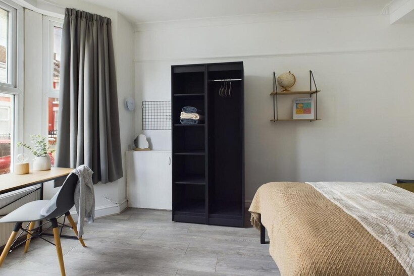 A bright and inviting double bedroom featuring ...