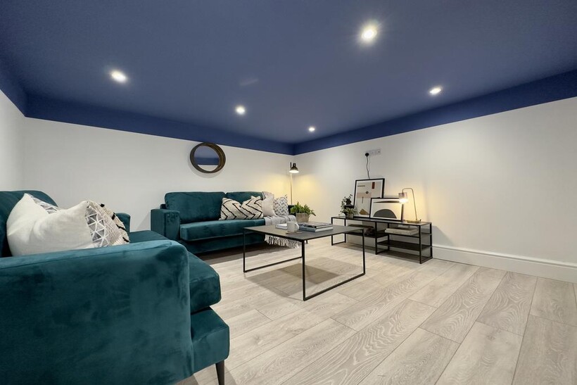 A spacious and inviting modern living room feat...